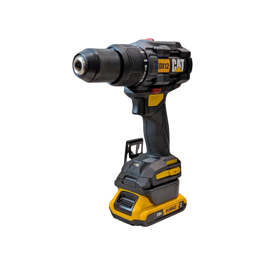 DeWalt 20V MAX to CAT 18V battery adapter - installed on a hammer drill, seated on the battery pack