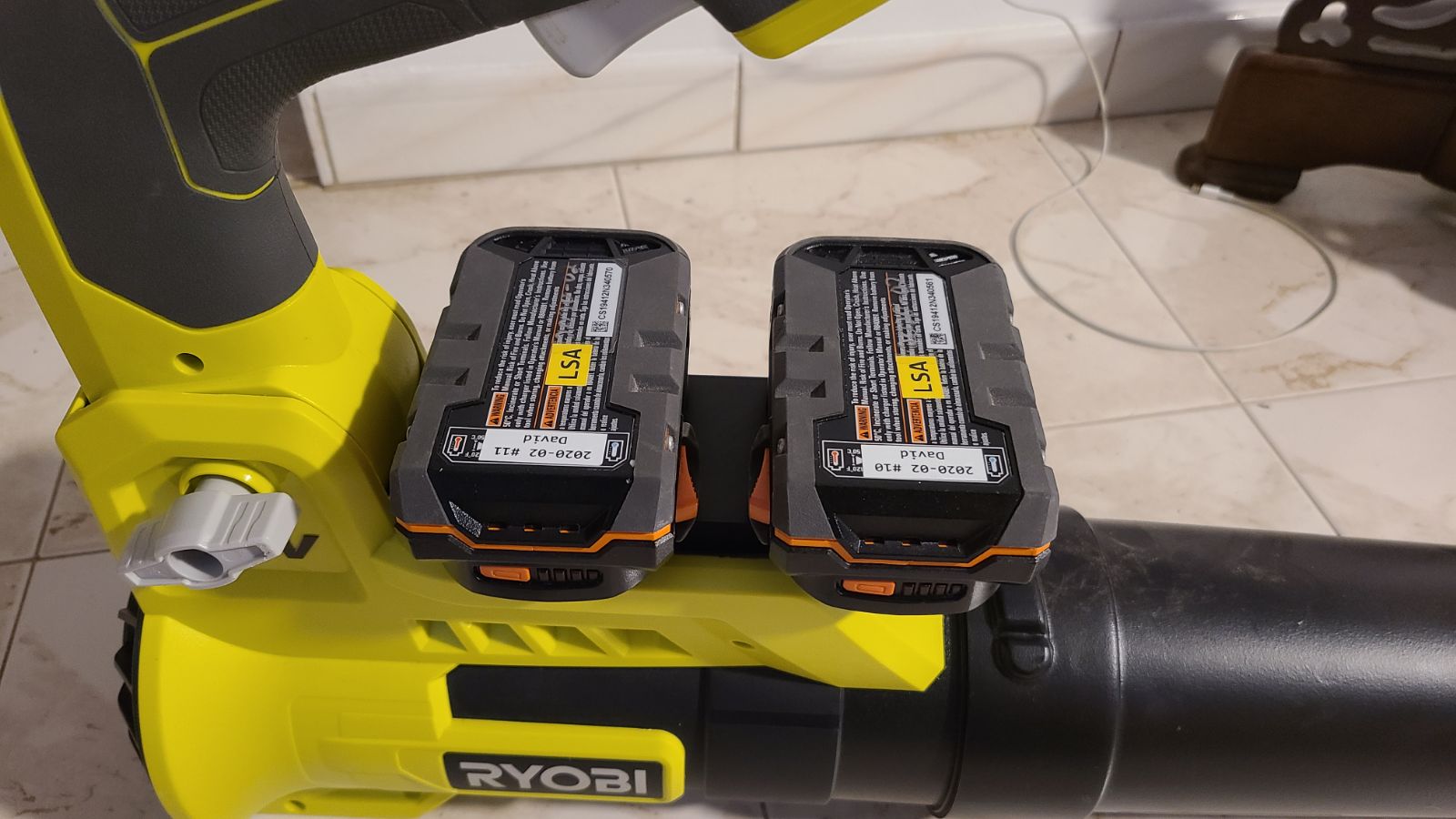 RIDGID 18V to Ryobi 36V/40V battery adapter - installed on a blower with two battery packs seated in the adapter