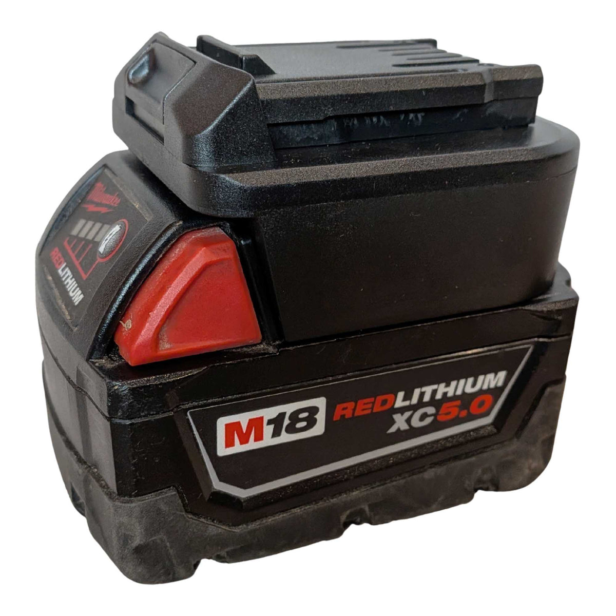 Milwaukee M18 to CAT 18V battery adapter - fitted to the Milwaukee M18 battery, CAT tool-side face upward