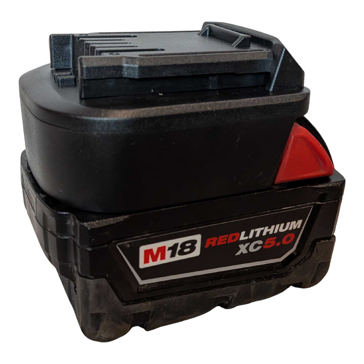 Milwaukee M18 to CAT 18V battery adapter - fitted to the Milwaukee M18 battery, CAT tool-side face upward