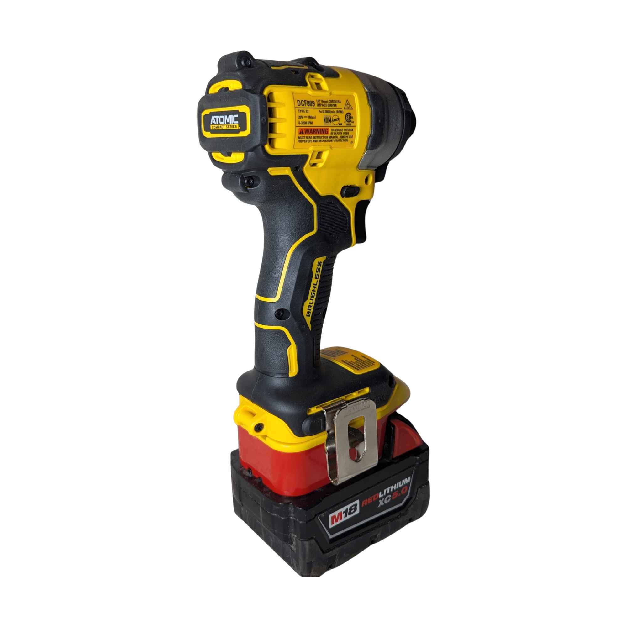 Milwaukee M18 to DeWalt 20V MAX battery adapter - installed on a DeWalt impact driver, rear view with the belt clip