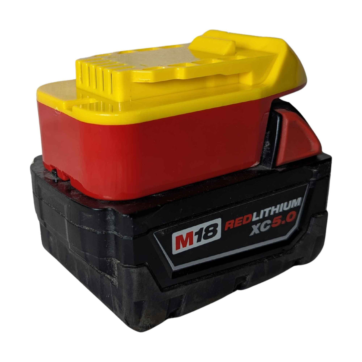 Milwaukee M18 to DeWalt 20V MAX battery adapter - fitted to the Milwaukee M18 battery, release catch and fuel gauge in view
