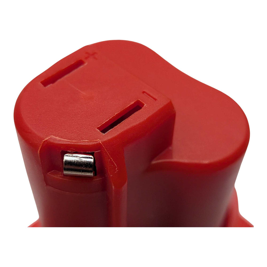 Porter Cable 20V to Milwaukee M12 battery adapter - close-up of the tool-side terminal slots, moulded + and - polarity marks